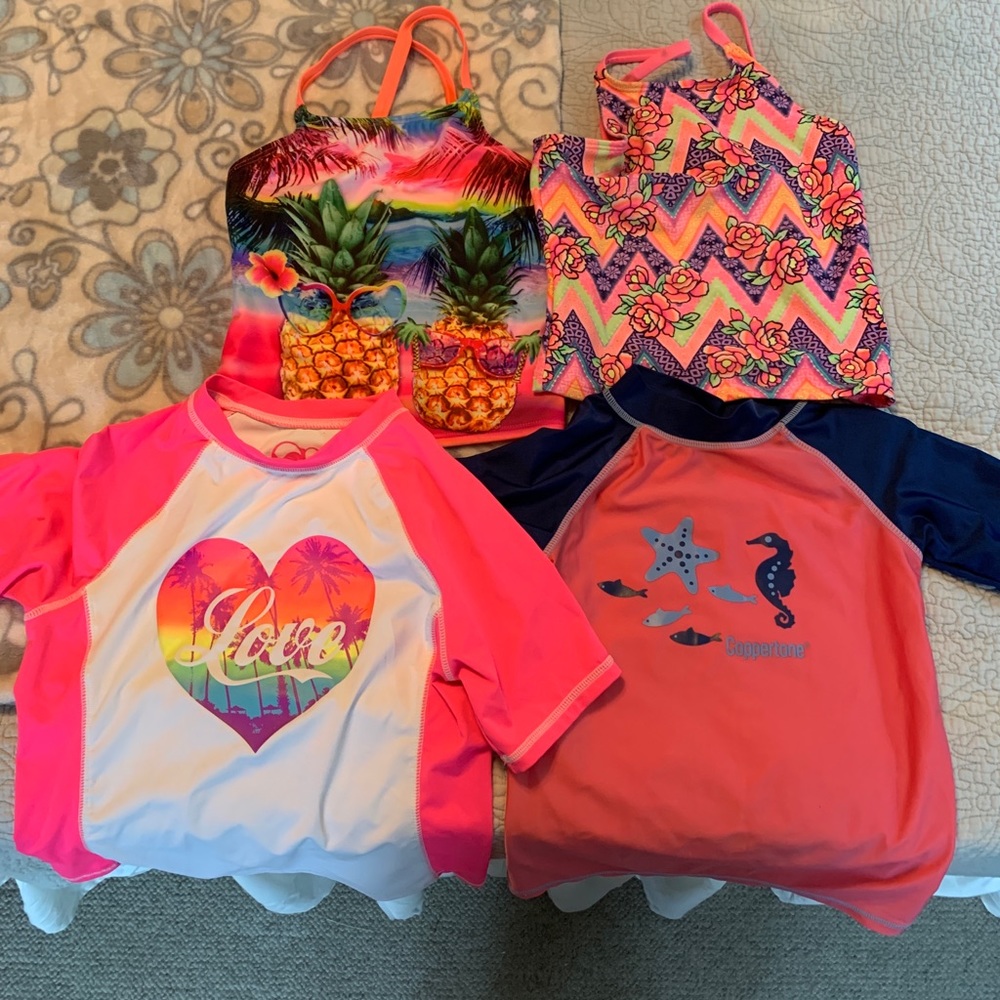Four Girls Bathing Suit Tops. Sizes M and one L.
